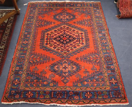 An Afghan brick ground rug Approx. 200 x 155cm